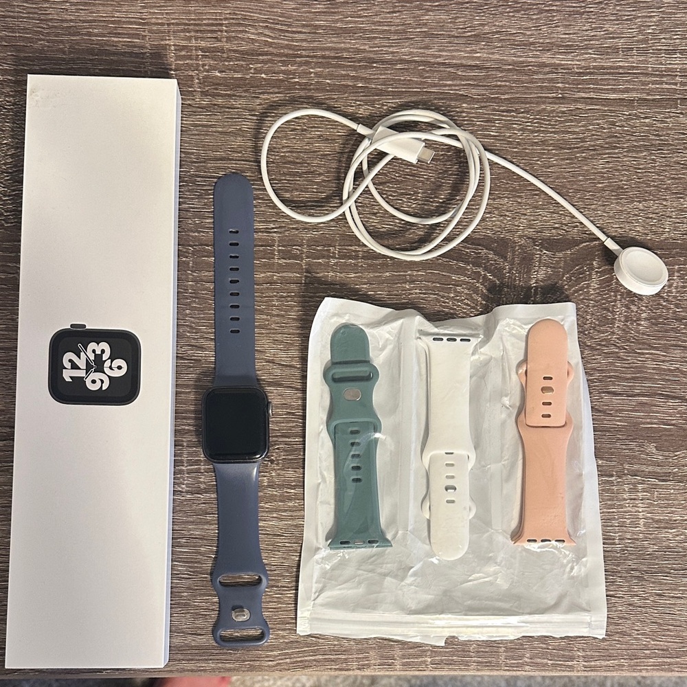 Apple Smartwatch with Blue Band and Green, White, Peach Silicone Bands